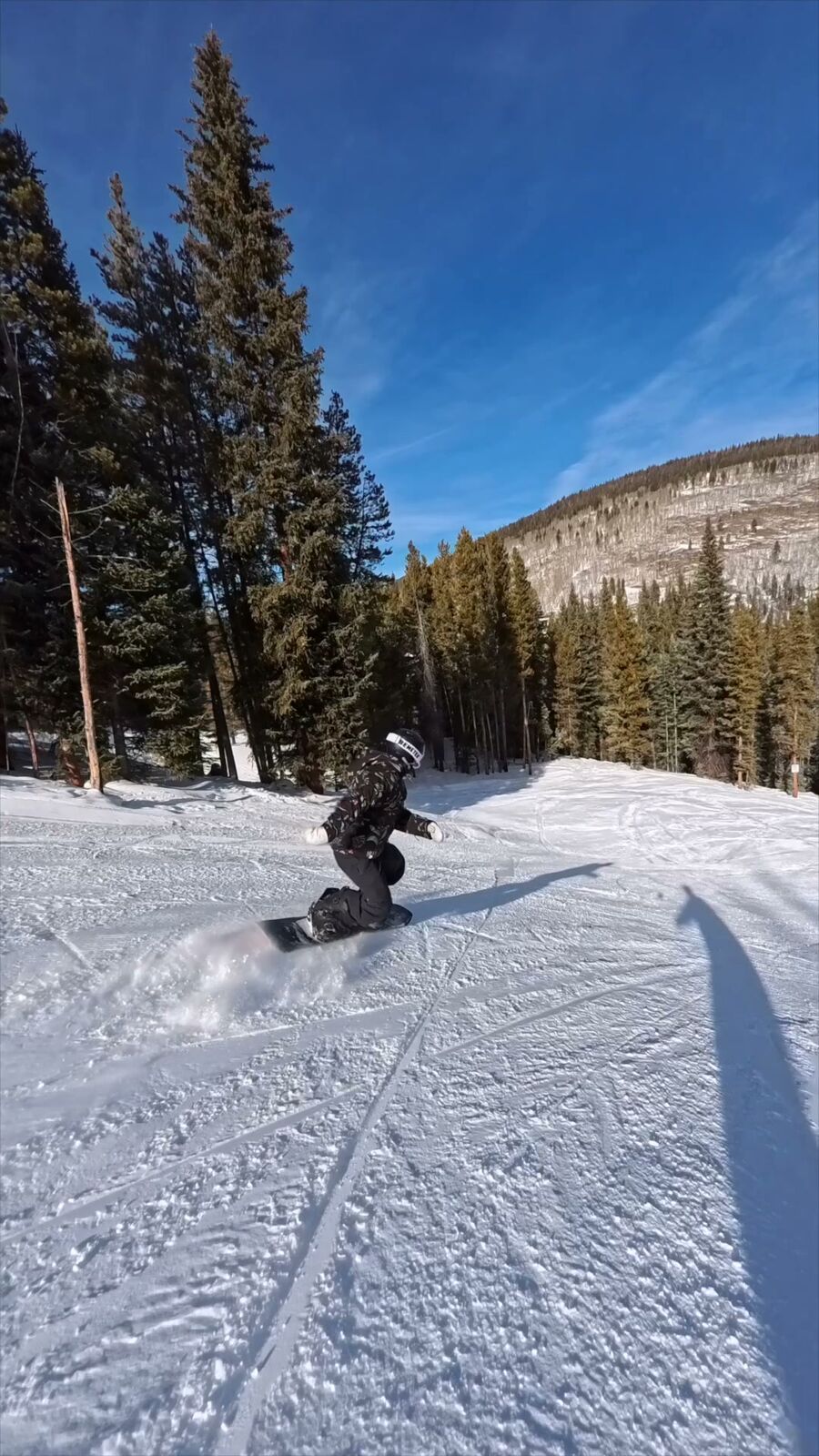 Snowboarder approaching a jump at Mt. Hood