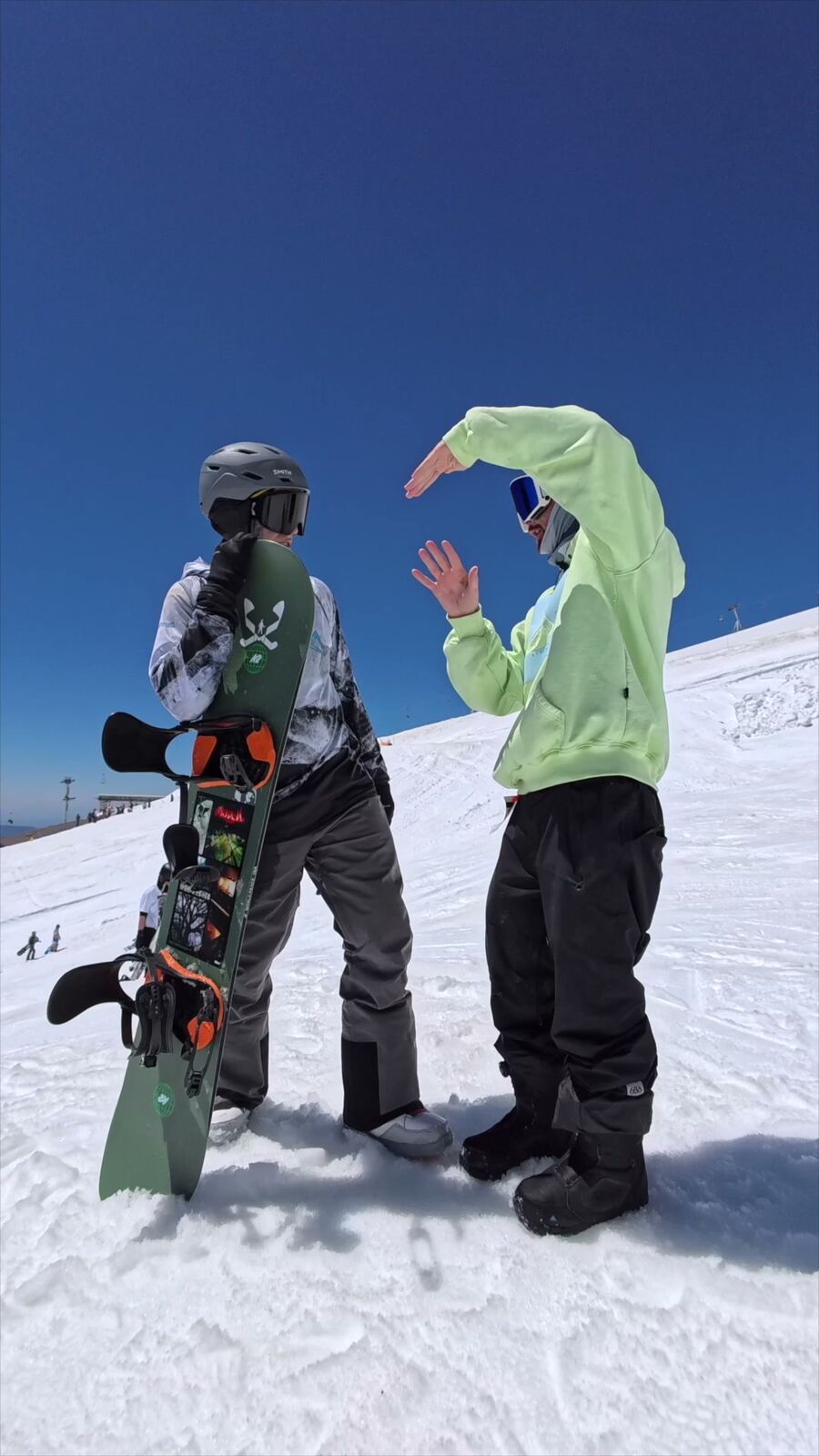 Coach working with a camper on the mountain